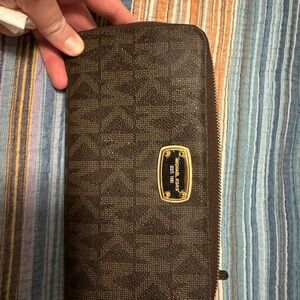 Michael Kors Jet Set Travel continental zip-around wallet in brown monogram